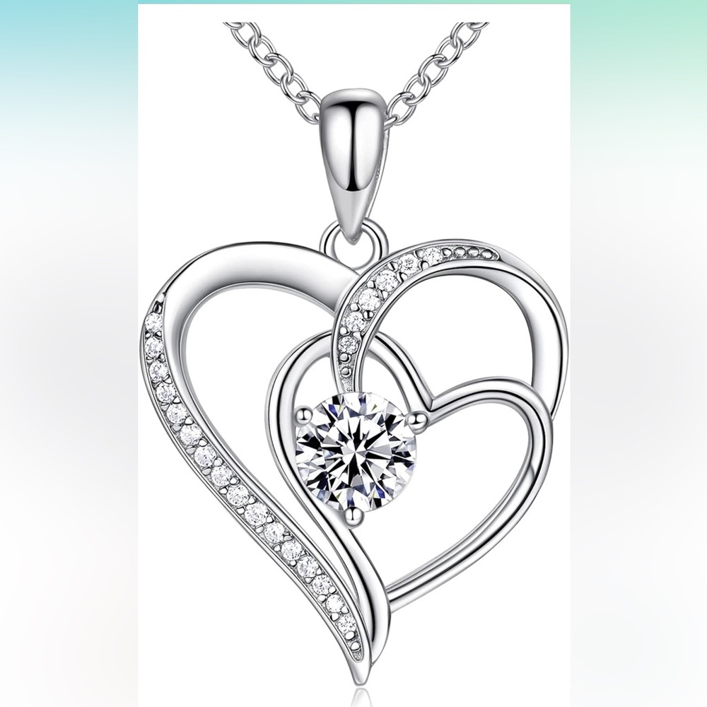 OR Old Rubin Sterling Silver heart pendant with cubic zirconia.